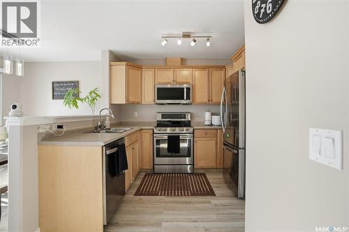 18 4425 Nicurity Drive, Regina, SK - Indoor Photo Showing Kitchen With Stainless Steel Kitchen With Double Sink