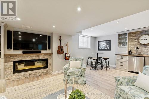Fireplace with Stone surround - 407 Seneca Court, Newmarket, ON - Indoor Photo Showing Living Room With Fireplace