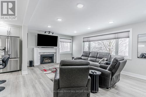 106 Brant Street W, Orillia, ON - Indoor Photo Showing Living Room With Fireplace