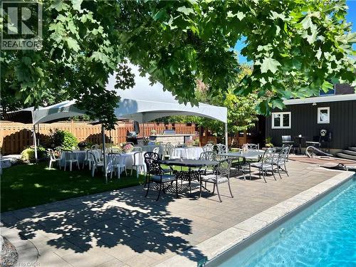 Lovely shady areas as well as sunlit for all your family & guests! - 29 Woodside Drive, Hamilton, ON - Outdoor With In Ground Pool With Deck Patio Veranda