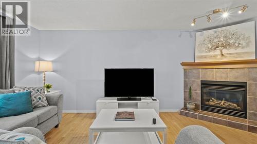 158 Covemeadow Road Ne, Calgary, AB - Indoor Photo Showing Living Room With Fireplace