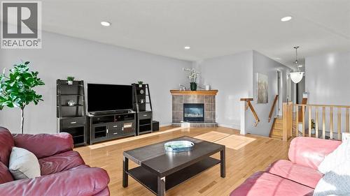 158 Covemeadow Road Ne, Calgary, AB - Indoor Photo Showing Living Room With Fireplace