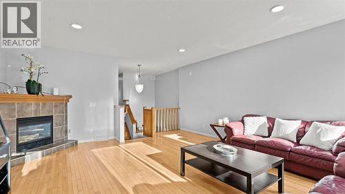 158 Covemeadow Road Ne, Calgary, AB - Indoor Photo Showing Living Room With Fireplace