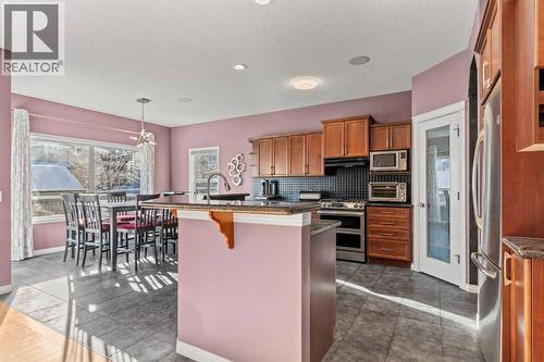 15 Chapalina Close Se, Calgary, AB - Indoor Photo Showing Kitchen With Stainless Steel Kitchen