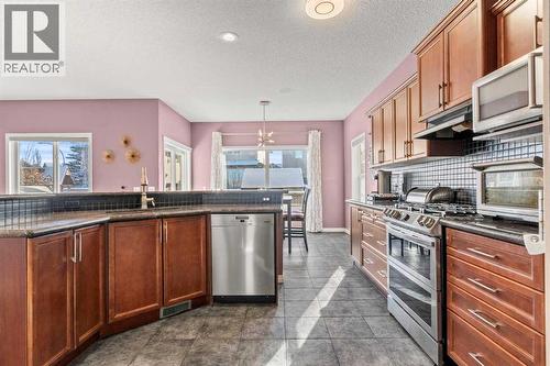 15 Chapalina Close Se, Calgary, AB - Indoor Photo Showing Kitchen With Stainless Steel Kitchen