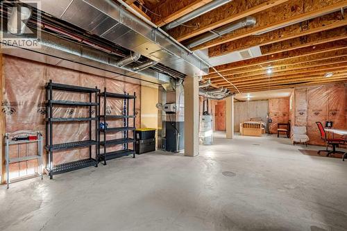 1101, 281 Cougar Ridge Drive Sw, Calgary, AB - Indoor Photo Showing Basement