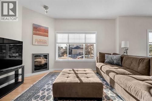 1101, 281 Cougar Ridge Drive Sw, Calgary, AB - Indoor Photo Showing Living Room With Fireplace