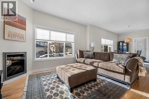 1101, 281 Cougar Ridge Drive Sw, Calgary, AB - Indoor Photo Showing Living Room With Fireplace