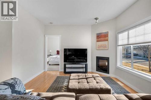 1101, 281 Cougar Ridge Drive Sw, Calgary, AB - Indoor Photo Showing Living Room With Fireplace
