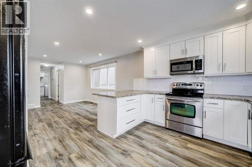 Kitchen Facing Dining Room - 203 1 Street, Shaughnessy, AB - Indoor Photo Showing Kitchen