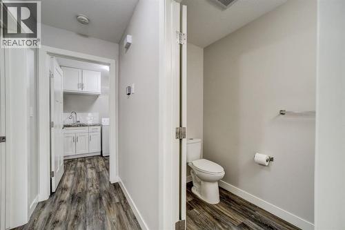 Hall with 2-Piece Bath - 203 1 Street, Shaughnessy, AB - Indoor Photo Showing Bathroom