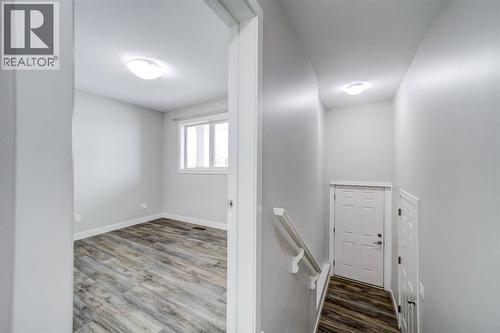 Bedroom and Hall to Garage - 203 1 Street, Shaughnessy, AB - Indoor Photo Showing Other Room