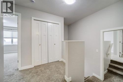 Upstairs Hallway + Storage - 203 1 Street, Shaughnessy, AB - Indoor Photo Showing Other Room