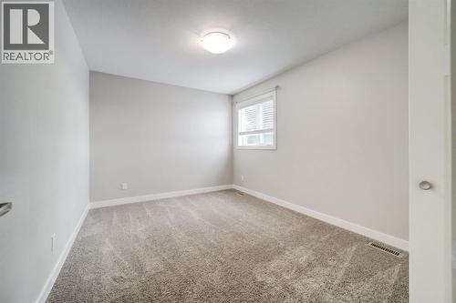 Upstairs Bedroom #1 - 203 1 Street, Shaughnessy, AB - Indoor Photo Showing Other Room