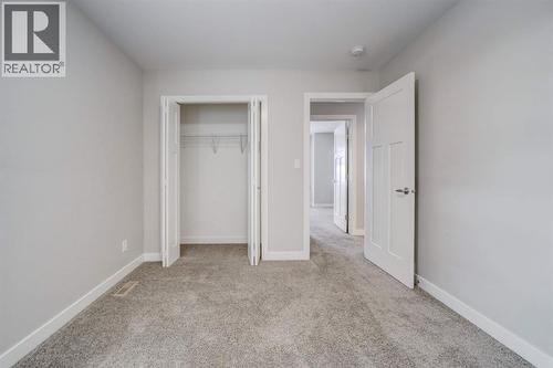 Upstairs Bedroom #1 - 203 1 Street, Shaughnessy, AB - Indoor Photo Showing Other Room