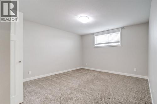 Basement Bedroom #1 - 203 1 Street, Shaughnessy, AB - Indoor Photo Showing Other Room