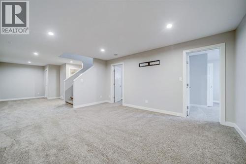 Rec Room + 2 Bedrooms - 203 1 Street, Shaughnessy, AB - Indoor Photo Showing Basement