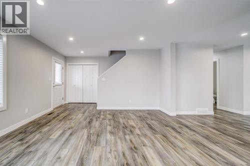 Living Room Facing Entry - 203 1 Street, Shaughnessy, AB - Indoor Photo Showing Other Room
