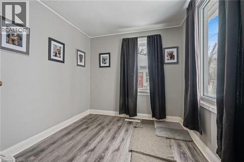 Unfurnished room featuring light wood-style flooring and ornamental molding - 234 Head Street N, Simcoe, ON - Indoor Photo Showing Other Room