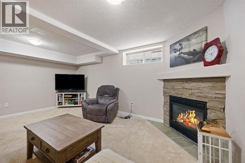 3904 63 Avenue, Lloydminster, AB - Indoor Photo Showing Living Room With Fireplace