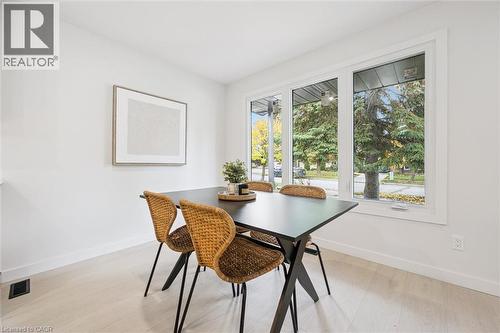 Dining space featuring baseboards and light wood-type flooring - 459 Drummerhill Crescent, Waterloo, ON - Indoor Photo Showing Dining Room