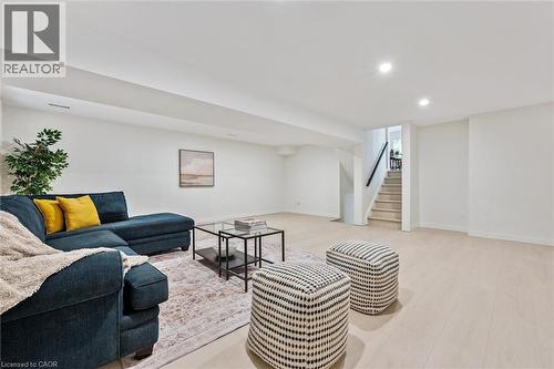 Living room featuring recessed lighting, light wood-style flooring, and stairs - 459 Drummerhill Crescent, Waterloo, ON - Indoor