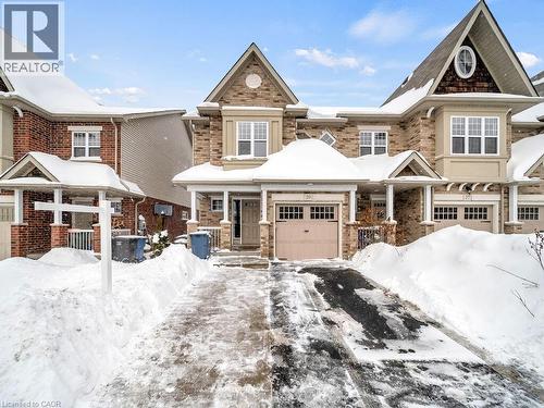 View of front of house with a porch and brick siding - 29 Amsterdam Crescent, Guelph, ON - Outdoor With Facade