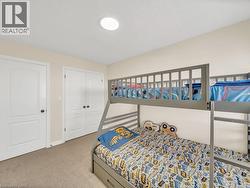 Bedroom with carpet floors and a closet - 