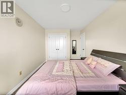 Bedroom featuring baseboards and a closet - 