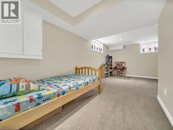 Bedroom with light colored carpet and baseboards - 