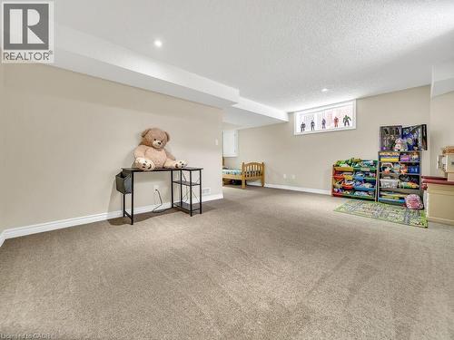 Playroom featuring carpet flooring and a textured ceiling - 29 Amsterdam Crescent, Guelph, ON - Indoor Photo Showing Other Room