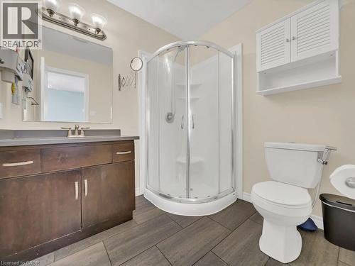 Full bath with a shower stall, vanity, and wood finish floors - 29 Amsterdam Crescent, Guelph, ON - Indoor Photo Showing Bathroom