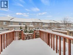 Snow covered deck with a residential view - 