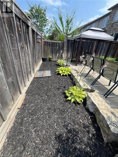 Fenced backyard featuring a gazebo and a patio area - 29 Amsterdam Crescent, Guelph, ON - Outdoor