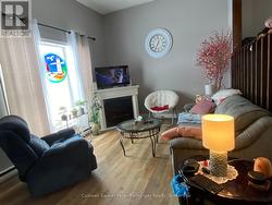 Large living room windows provide west view. - 