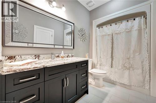 Full bath featuring vanity and shower / tub combo with curtain - 107 Forbes Crescent, Listowel, ON - Indoor Photo Showing Bathroom