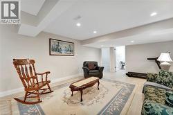 Sitting room featuring light wood-style floors and recessed lighting - 