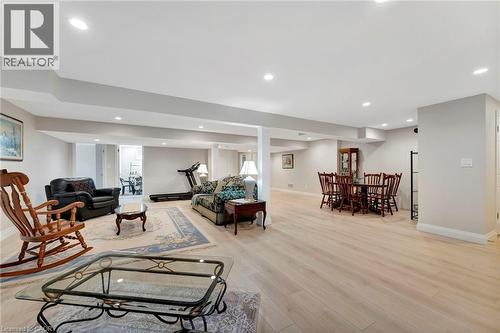 Living room with light wood-type flooring and recessed lighting - 107 Forbes Crescent, Listowel, ON - Indoor