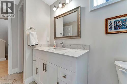 Bathroom with vanity and baseboards - 107 Forbes Crescent, Listowel, ON - Indoor Photo Showing Bathroom