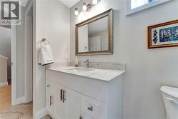 Bathroom with vanity and baseboards - 