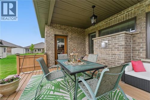 View of patio / terrace with outdoor dining space and a wooden deck - 107 Forbes Crescent, Listowel, ON - Outdoor With Deck Patio Veranda With Exterior