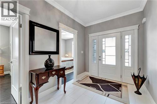 Entryway with baseboards and ornamental molding - 107 Forbes Crescent, Listowel, ON - Indoor Photo Showing Other Room