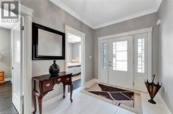 Entryway with baseboards and ornamental molding - 