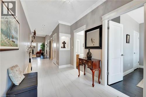 Corridor with crown molding and recessed lighting - 107 Forbes Crescent, Listowel, ON - Indoor Photo Showing Other Room