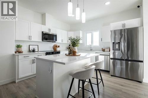 67 Appaloosa Way, Cochrane, AB - Indoor Photo Showing Kitchen With Upgraded Kitchen