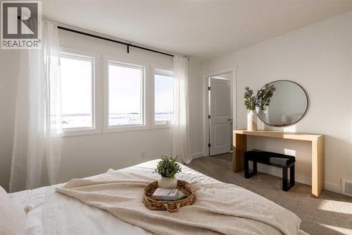 67 Appaloosa Way, Cochrane, AB - Indoor Photo Showing Bedroom