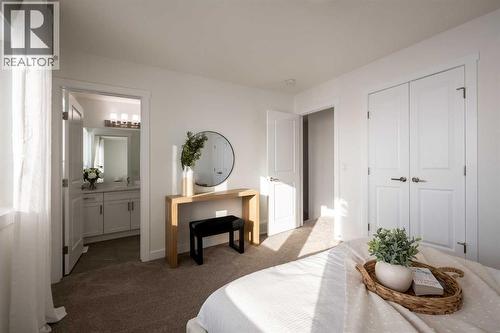 67 Appaloosa Way, Cochrane, AB - Indoor Photo Showing Bedroom