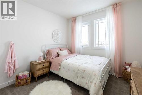 67 Appaloosa Way, Cochrane, AB - Indoor Photo Showing Bedroom