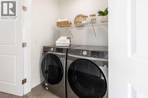 67 Appaloosa Way, Cochrane, AB - Indoor Photo Showing Laundry Room