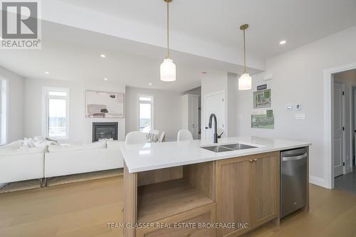 Lot 17 - 71 Dearing Drive, South Huron (Stephen), ON - Indoor Photo Showing Kitchen With Fireplace With Double Sink With Upgraded Kitchen